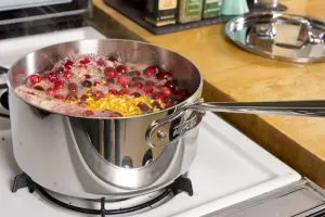 AllCladOnStoveFeaturedImage AC Sauce Pan on Stove - All Clad D3 Vs D5: Which Is Better?