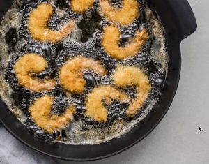 CastIronDeepFryingShrimp The Best Cast Iron Skillet: How Much Should You Spend?