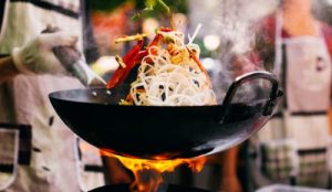 Wok with stir fry and fire Wok with stir fry and fire