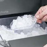 Opal Ice Maker Featured Image Person scooping up nugget ice from ice maker