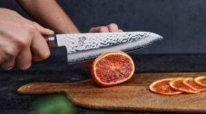 Miyabi knife cutting orange Miyabi knife cutting orange