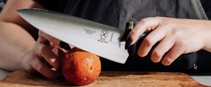 Mercer Knife cutting an orange Mercer Knife cutting an orange