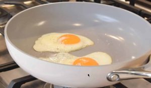 Caraway skillet with eggs Caraway nonstick has a nice thickness and heft, resulting in very good heating. The walls are about 3mm thick, which is plenty of aluminum for even heating and fairly good heat retention.