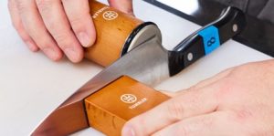 Tumbler rolling knife sharpener in use Tumbler rolling knife sharpener in use
